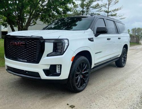 White 2021 GMC Yukon Denali XL shows off its blacked-out two-tone restyling package from Auto Additions in Westerville, Ohio